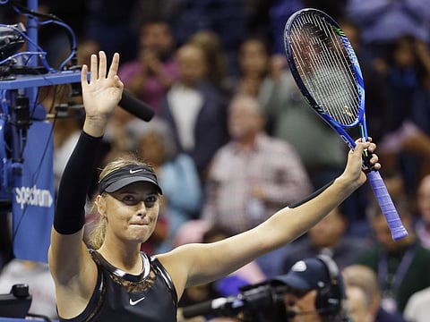 Mari Sharapova, of Russia, waves to the crowd after defeating Sofia Kenin, of the United States, 7-5, 6-2 at the U.S. Open tennis tournament in New York. | AP