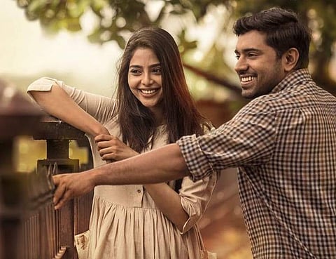 Aishwarya Lekshmi and Nivin Pauly in a still from 'Njandukalude Naattil Oridavela'