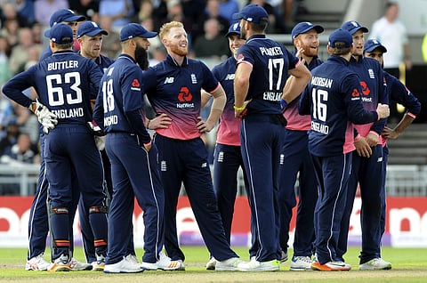 England's Ben Stokes, centre, reacts after a successful review for West Indies Marlon Samuels wicket is confirmed on ground screen during the first One Day International match between England and West Indies at Old Trafford. | AP