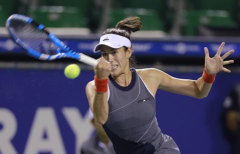Garbine Muguruza of Spain returns a shot to Monica Puig of Puerto Rico (AP)