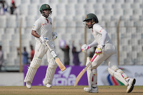 Bangladesh's captain Mushfiqur Rahim, right, and teammate Sabbir Rahman runs between the wickets during the first day of their second test cricket match against Australia in Chittagong, Bangladesh.|AP