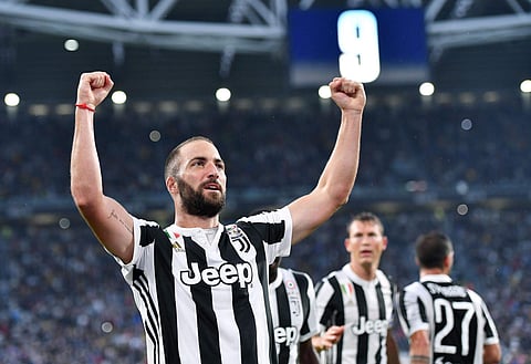 Juventus's Gonzalo Higuain celebrates after scoring a goal during the Italian Serie A Soccer match between Juventus and Chievo at the Allianz Stadium in Turin, Italy. | AP