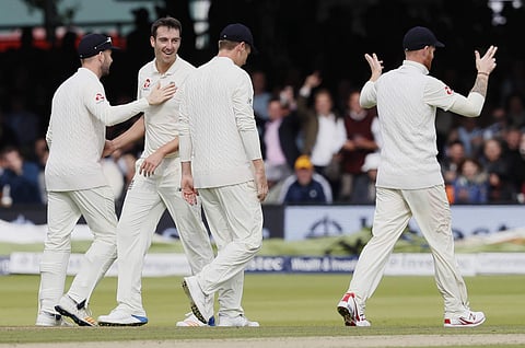 England's Toby Roland-Jones, second left, celebrates taking the wicket of West Indies' Shai Hope on the first day of the third test match between England and the West Indies at Lord's cricket ground in London. | AP
