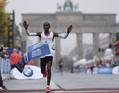 Kenya's Eliud Kipchoge crosses the line to win the 44th Berlin marathon in Berlin, Germany, Sunday, Sept. 24, 2017. | AP