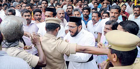 Police attempting to disperse the followers of Jacobite and Orthodox Church factions after the Catholicos was locked up in St Mary’s Church at Varikoli, Puthencruz, on Sunday