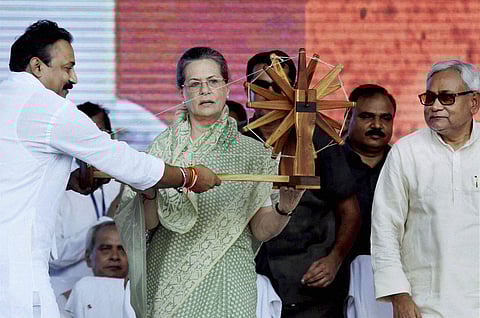 Congress President Sonia Gandhi being presented Charkha by Bihar Pradesh Congress Committee President Ashok Choudhary as Bihar Chief Minister and Senior JD(U) Leader Nitish Kumar looks on during the Swabhiman rally, at Gandhi Maidan. | PTI File Photo