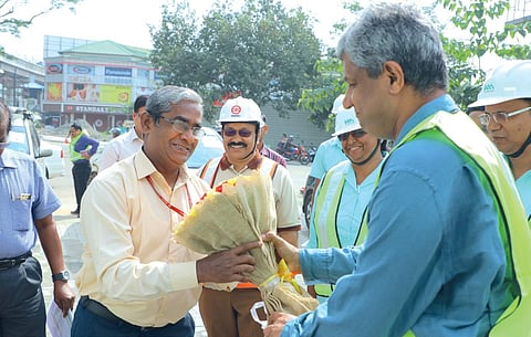 KMRL managing director Elias George welcoming Commissioner of Metro Rail Safety K M Manoharan in Kochi on Monday | Express