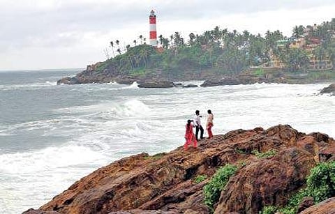 Tourists taking pictures at Vizhinjam | EXPRESS