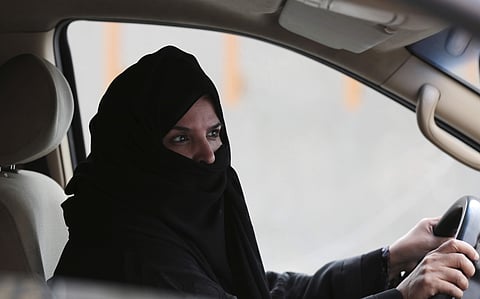 FILE- In this Saturday March 29, 2014 file photo, a woman drives a car on a highway in Riyadh, Saudi Arabia, as part of a campaign to defy Saudi Arabia's ban on women driving. (Photo | AP)