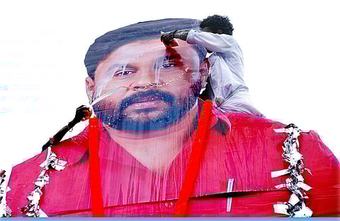 Fans anoint actor Dileep's cut out with milk after the film show at Saritha Theatre in Kochi (EPS | K Shijith)