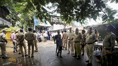Policemen near the Elphinstone railway station's foot over bridge where a stampede took place in Mumbai on Friday. | PTI