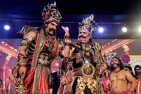 Bollywood actors Mukesh Rishi dress up as Rawan and Raza Murad dress up as Kumbhkaran perform during a Ramlila at Red Fort Ground in New Delhi on Thursday. | PTI