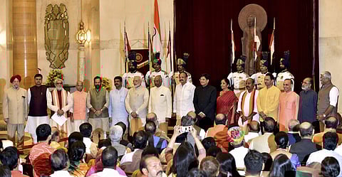Newly sworn in ministers pose with the President and the Prime minster at Rashtrapati Bhawan in New Delhi on Sunday. (PTI)