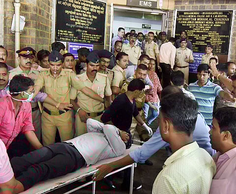 An injured being shifted to a hospital in Mumbai on Friday after a stampede at Elphinstone railway station. | PTI