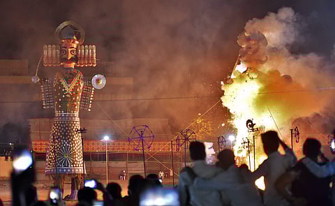 Effigies of Ravana and his brother Kumbhakaran being set on fire during Dussehra celebrations at Ramlila Ground in New Delhi on Saturday. (Photo | PTI)