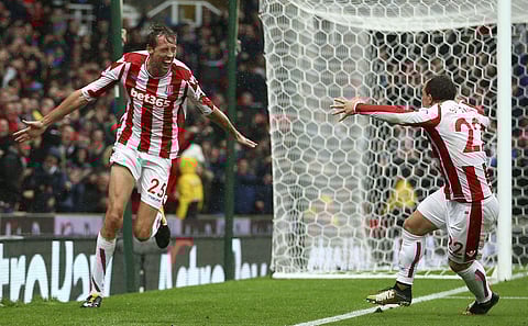Stoke City's Peter Crouch, left, celebrates scoring his side's second goal with team-mate Xherdan Shaqiri during the English Premier League soccer match between Stoke City and Southampton. | AP