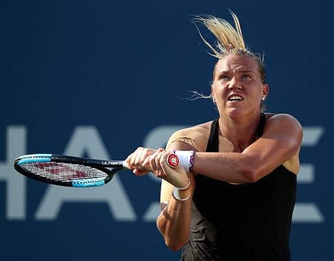 Kaia Kanepi, of Estonia, returns a shot from Darya Kasatkina, of Russia, during the fourth round of the U.S. Open tennis tournament. | AP