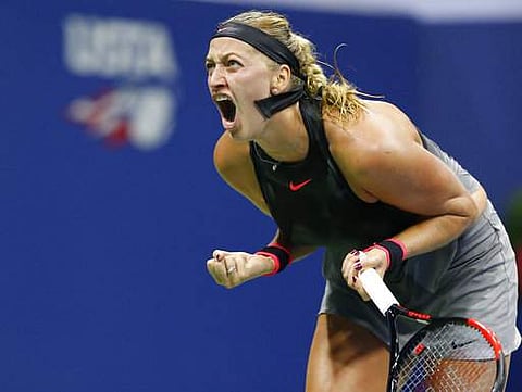 Petra Kvitova, of the Czech Republic, reacts toward her coaches and family box after saving her serve in the second set of a fourth round match against Garbine Muguruza. | AP