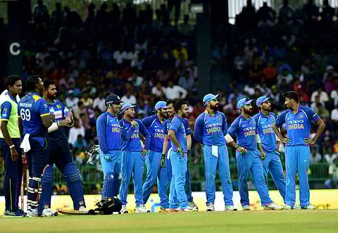 Indian team players wait for a review decision on Sri Lankan batsman Angelo Mathews during the fifth ODI match in Colombo on Sunday. | PTI