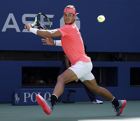 Rafael Nadal, of Spain, races to return a shot to Alexandr Dolgopolov, of Ukraine, during the fourth round of the U.S. Open (AP)