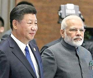 China’s Xi Jinping with PM Narendra Modi in Xiamen on Tuesday. | PTI