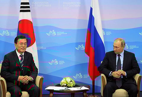 Russian President Vladimir Putin, right, look at South Korean President Moon Jae-in during their meeting at the Eastern Economic Forum in Vladivostok, Russia on Wednesday. (Photo | AP)