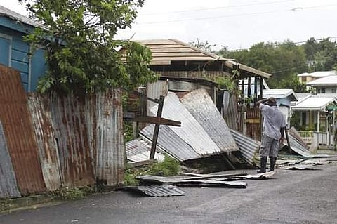 A man surveys the wreckage on his property after the passing of Hurricane Irma, in St. John's, Antigua and Barbuda. | AP