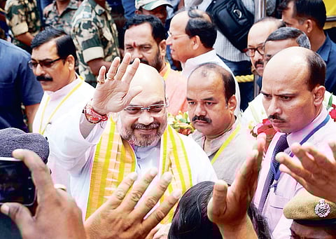 Bharatiya Janata Party president Amit Shah waving to his supporters on his arrival in Bhubaneswar on Wednesday | Express