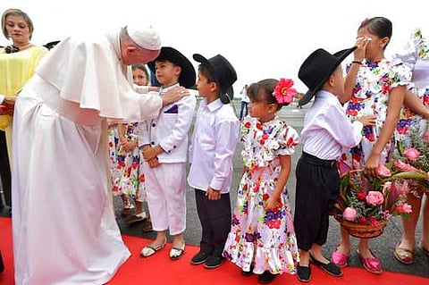 Pope Francis is welcomed by a group of children upon his arrival in Villavicencio, Colombia (AP)