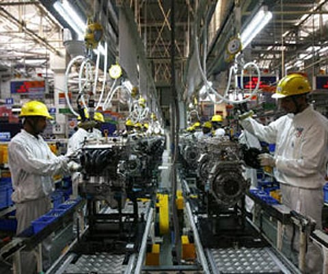 Employees work inside Maruti Suzuki's engine plant. (File photo | Reuters)