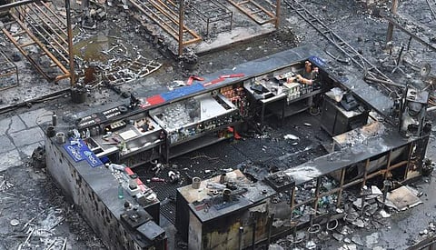 A burned bar counter is seen among the charred remains of a restobar where a rooftop party was being held in Mumbai early on December 29, 2017. (AFP)