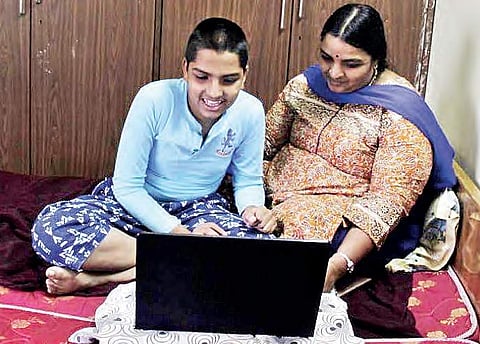 B Aravind, a 14-year-old autistic boy, interacting with his mother in Miyapur in Hyderabad on Tuesday | sathya Keerthi