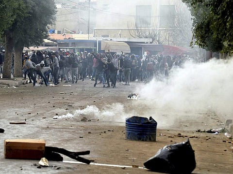 Protesters take the streets in Tebourba, south of the Tunisian capital, Tunis, during anti-government protests. (Photo | AP)