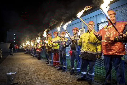 The night shift workers meet for a warning strike assembly of the IG Metall (Industrial Union of Metalworkers) in front of the gates of the Aluminium Norf GmbH in Neuss, Germany, Tuesday, Jan. 9, 2018. (Photo | Associated Press)