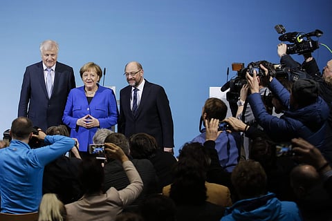German Chancellor Angela Merkel, center, Bavarian governor Horst Seehofer, left, and Social Democratic Party Chairman Martin Schulz. (AP Photo)