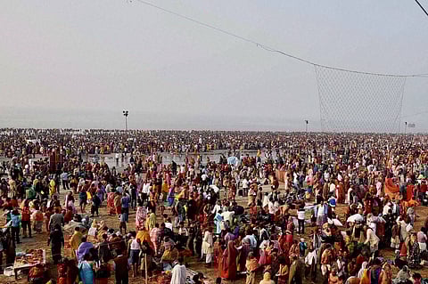 Devotees taking holy dip at Gangasagar the confluence of River Ganga and Bay of Bengal on the occasion of Makar Sankranti.