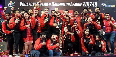 Hyderabad Hunters team members pose for photograph along with Team Championship Trophy after winning the Vodafone Premier Badminton League. (Photo | PTI)