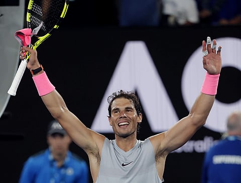 Spain's Rafael Nadal waves after defeating Victor Estrella Burgos of the Dominican Republic during their first round match at the Australian Open | AP