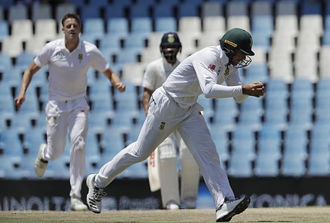 South Africa's fielder Aiden Markram, right, takes a catch as teammate bowler Morne Morkel‚ reacts to a wicket. (Photo | AP)