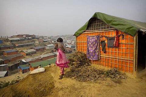 A Rohingya Muslim girl wears a sweater standing outside her tent at Balukhali refugee camp 50 kilometres (32 miles) from Cox's Bazar, Bangladesh. | AP