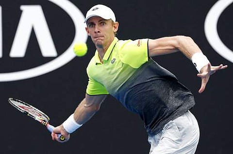 South Africa's Kevin Anderson makes a forehand return to Britain's Kyle Edmund during their first round match at the Australian Open tennis championships in Melbourne, Australia on Monday | Photo: AP