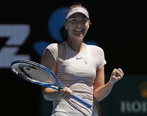 Russia's Maria Sharapova celebrates after she won over Germany's Tatjana Maria during their first round match at the Australian Open | AP