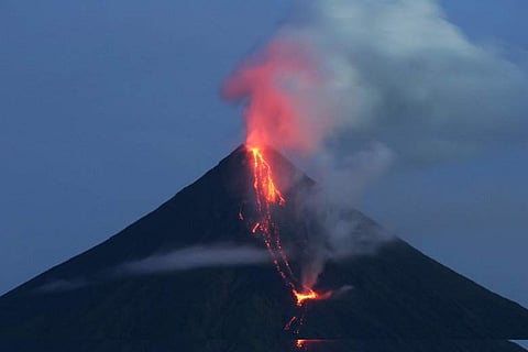 In this July 2006 file photo, Lava pours down the slopes of Mayon volcano. (Associated Press)