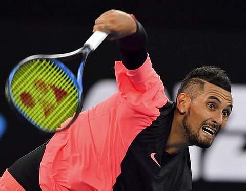 Australia's Nick Kyrgios serves to Brazil's Rogerio Dutra Silva during their first round match at the Australian Open tennis championships in Melbourne | Photo: AP