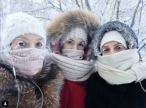 In this photo taken on Saturday, Jan. 13, 2018, Anastasia Gruzdeva, left, poses for selfie with her friends as the temperature dropped to about -50 degrees (-58 degrees Fahrenheit) in Yakutsk, Russia. (AP)