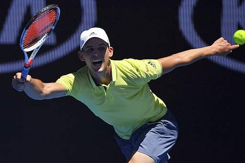 Austria's Dominic Thiem stretches out for a return shot to United States' Denis Kudla during their second round match at the Australian Open tennis championships in Melbourne | Photo: AP