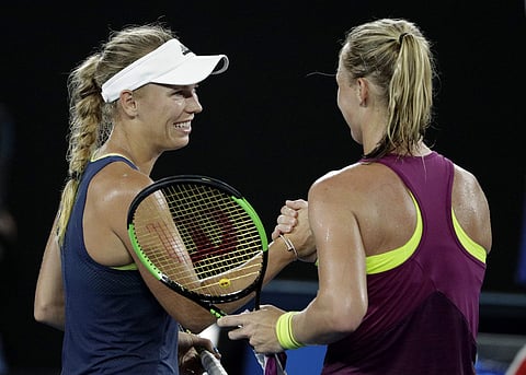 Denmark's Caroline Wozniacki (L) is congratulated by Kiki Bertens of the Netherlands after winning their third round match at the Australian Open