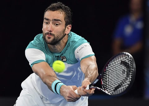 Croatia's Marin Cilic makes a backhand return to United States' Ryan Harrison during their third round match at the Australian Open | AP