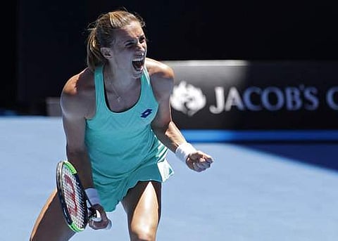 Croatia's Petra Martic celebrates after defeating Thailand's Luksika Kumkhum in their third round match at the Australian Open tennis championships in Melbourne. | Photo: AP