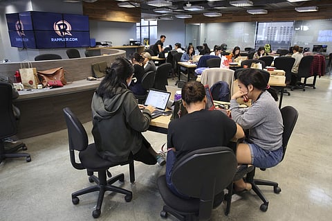 FILE photo of employees of Rappler, an online news outfit known for its critical reporting on Philippine President Rodrigo Duterte. | AP
